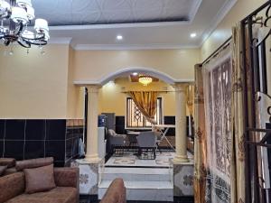 a living room with a couch and a table at Golden View Guest House in Lilongwe