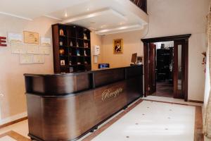 a barber shop with a wooden counter in a room at Albert Mountain Retreat & SPA in Lepşa +49 photos