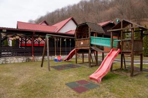 a playground with a slide at Albert Mountain Retreat & SPA in Lepşa