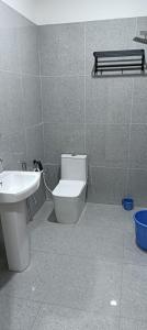 a bathroom with a toilet and a sink at The Royal Vintage Resort in Majhola +6 photos