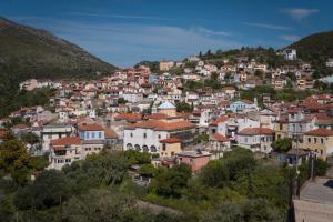 a town on a hill with houses at Aura 2 Apartment in Vathý