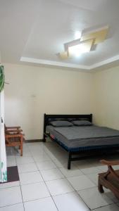 a bedroom with a bed and a ceiling at BROMO B&B in Bromo