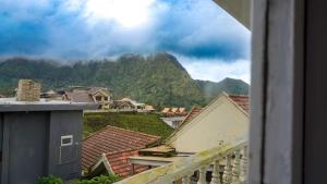 a view from a balcony of houses and mountains at BROMO B&B in Bromo