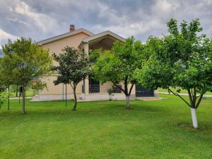 a house with trees in front of it at Green Oasis in Danilovgrad