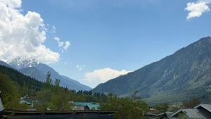a view of a valley with mountains in the background at THE NUN KUN Pahalgam in Pahalgām +24 photos