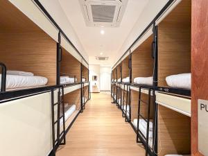 a row of bunk beds in a dorm room at Love Linn in George Town +18 photos