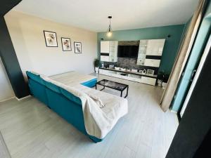 a bedroom with a bed and a table in it at Villa Alina with heated pool in Rogoznica
