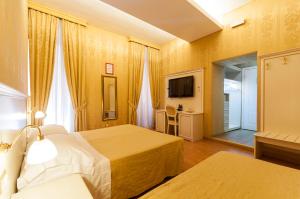 Postel nebo postele na pokoji v ubytování Trevi 41 Hotel + 37 fotografií