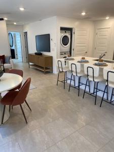 a large living room with a table and chairs at Todd's Relaxation Place in Maricopa +1 photo