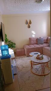 a living room with a couch and a table at Cozy cloud in Ruiru