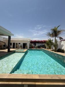 a large swimming pool in a villa at Paradis in Ngaparou
