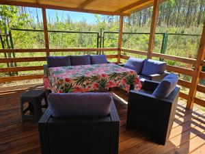 a screened in porch with a table and chairs at Oto Domek 1 in Międzyrzecz +11 photos