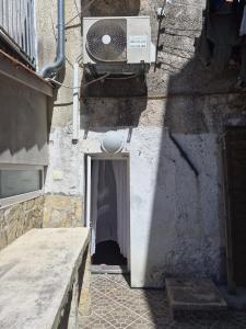a door to a building with a speaker above it at Apartment Sidro in Cres