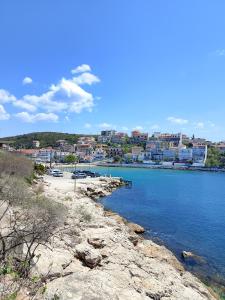 a view of a beach with a city in the background at VintageVilla in Skala Marion