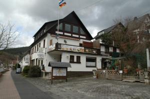 a large white building with a sign in front of it at Panoramablick 85 m2 5 persoons in Lennestadt