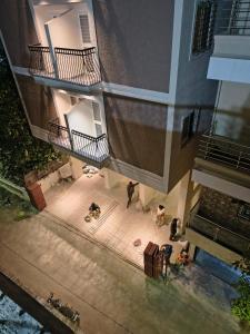 an overhead view of a building with people sitting on the ground at Zenia IT Rooms in Pune