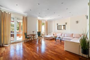 a living room with a couch and a table at Spa & Grill Family Villa - No Parties Allowed in Warsaw