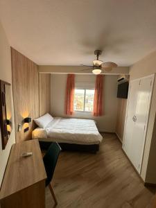 a small room with a bed and a window at Hotel Alain by Dynamic Hotels in Silla