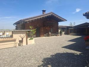a building with a deer standing in front of it at Chalet la dimora di Barbara in San Barnaba