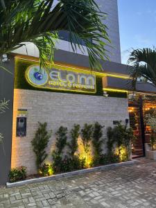 a building with a sign on the side of it at Pousada Elo Inn in Recife
