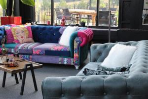 a living room with two blue couches and a table at Villa Baraka in İznik