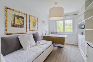 a living room with a couch and a table at Lovely Villa - By Y Concept in Setúbal +27 photos