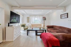 a living room with a couch and a table at Lovely Villa - By Y Concept in Setúbal