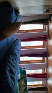 a close up of a bed with a window at Rautelahomestay in Harsil