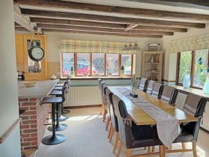 a dining room with a long table and chairs at Lambourne House - Ukc2831 in Skegness