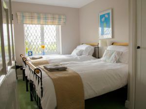 a bedroom with two beds and a window at Hayloft-E2699 in Winthorpe +20 photos