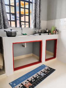 a toy kitchen with a counter and a sink at Joyland B&B in Mbita