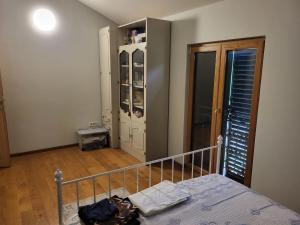 a bedroom with a bed and a closet at Green Oasis in Danilovgrad