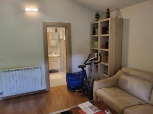 a living room with a couch and a vacuum at Green Oasis in Danilovgrad +23 photos