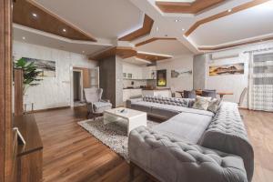 a living room with a couch and a table at Resort Bevilacqua in Budva