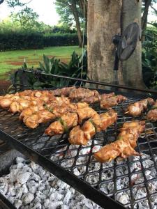 a bunch of food cooking on a grill at Morgenzon Estate in Pretoria