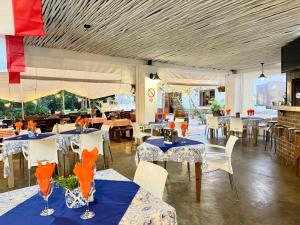 a restaurant with tables and chairs with blue and white tables at Morgenzon Estate in Pretoria