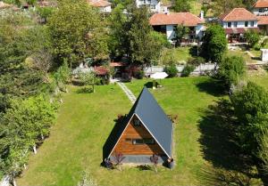 an overhead view of a small house in a field at Villa India A-Frame in Ledenik +30 photos