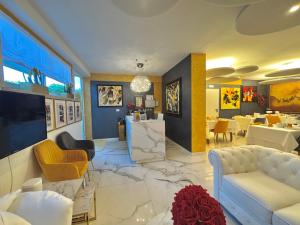 a living room with a couch and a table at Meublè Tripoli in Grado