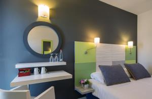 Postel nebo postele na pokoji v ubytování Prima City Hotel