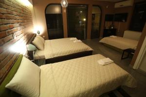 Postel nebo postele na pokoji v ubytování Hotel Korzo