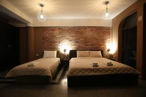 Postel nebo postele na pokoji v ubytování Hotel Korzo