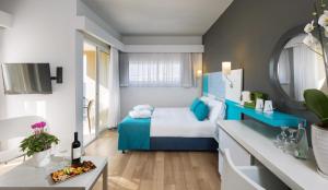 Postel nebo postele na pokoji v ubytování Prima City Hotel