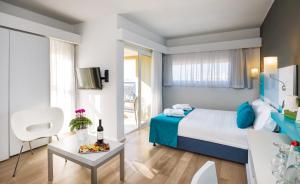 Postel nebo postele na pokoji v ubytování Prima City Hotel