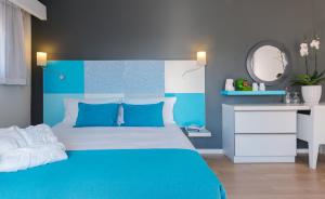 Postel nebo postele na pokoji v ubytování Prima City Hotel