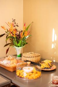 a table with two plates of food on a table at EvaZion River Side in Grande Rivière Sud Est +47 photos