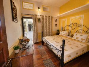 a bedroom with a bed in a room at C44thelocalhistory in Jaipur