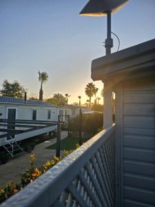 a view of a house with a porch and a deck at Premium Mobilhome Grimaud in Grimaud