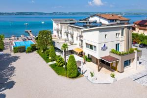an aerial view of a building with the ocean in the background at Hotel Tre Vele in Sirmione