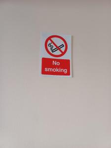 a no smoking sign on a white wall at The Orange room in Lincolnshire