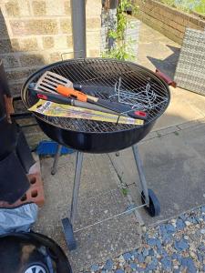 a grill with a bunch of tools on it at The Orange room in Lincolnshire